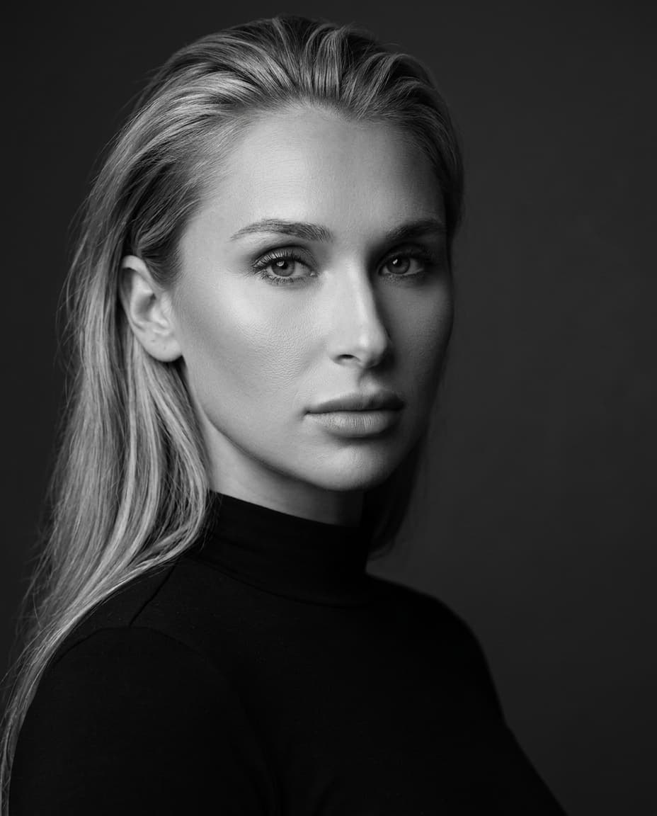 Black and white editorial portrait of Summer in a black high-neck top.