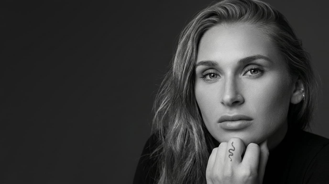 Black and white portrait of Summer with a direct, composed expression.